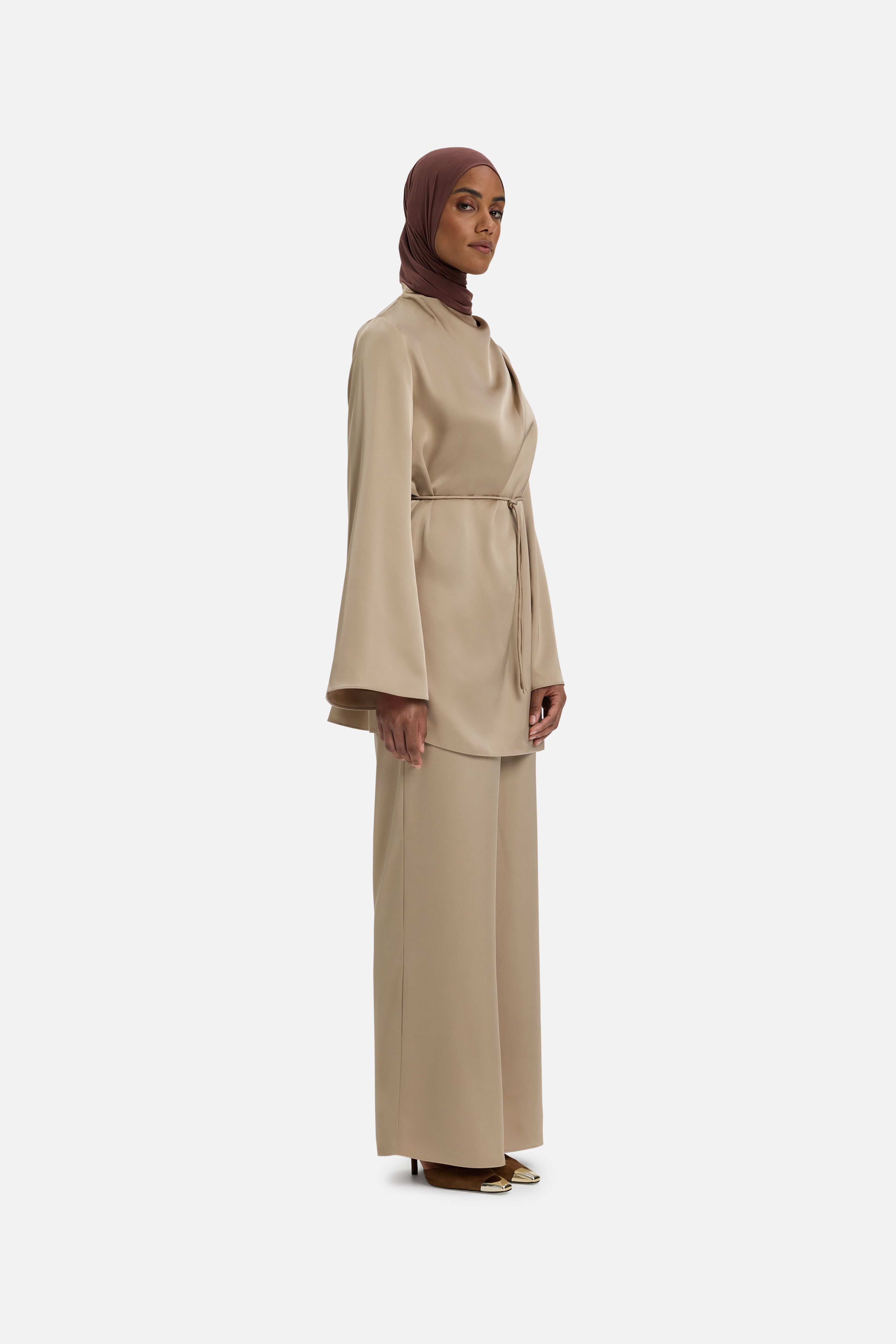 Side view model wearing mocha colored blouse
