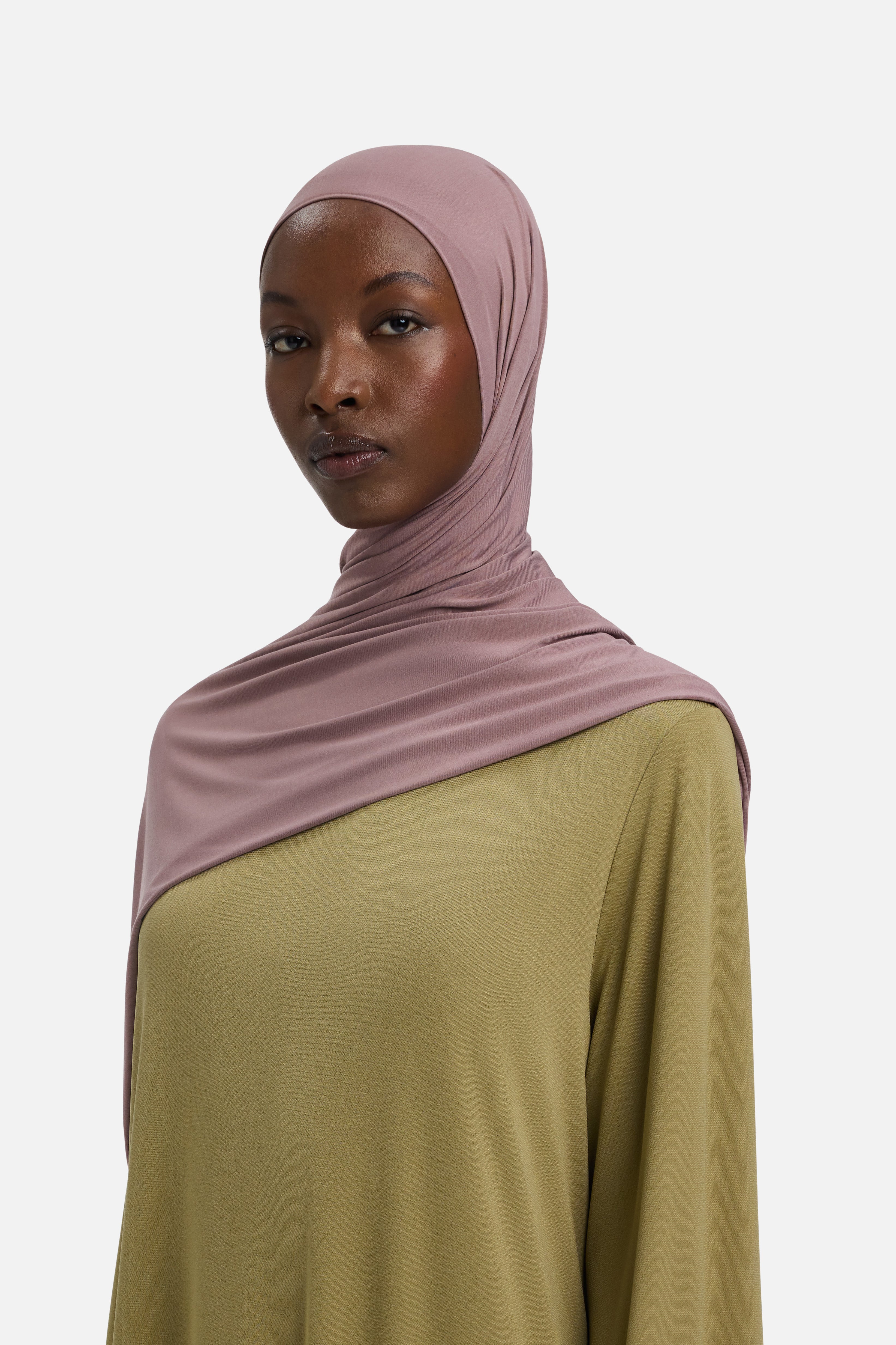 Model wearing purple MERRACHI headscarf, side view
