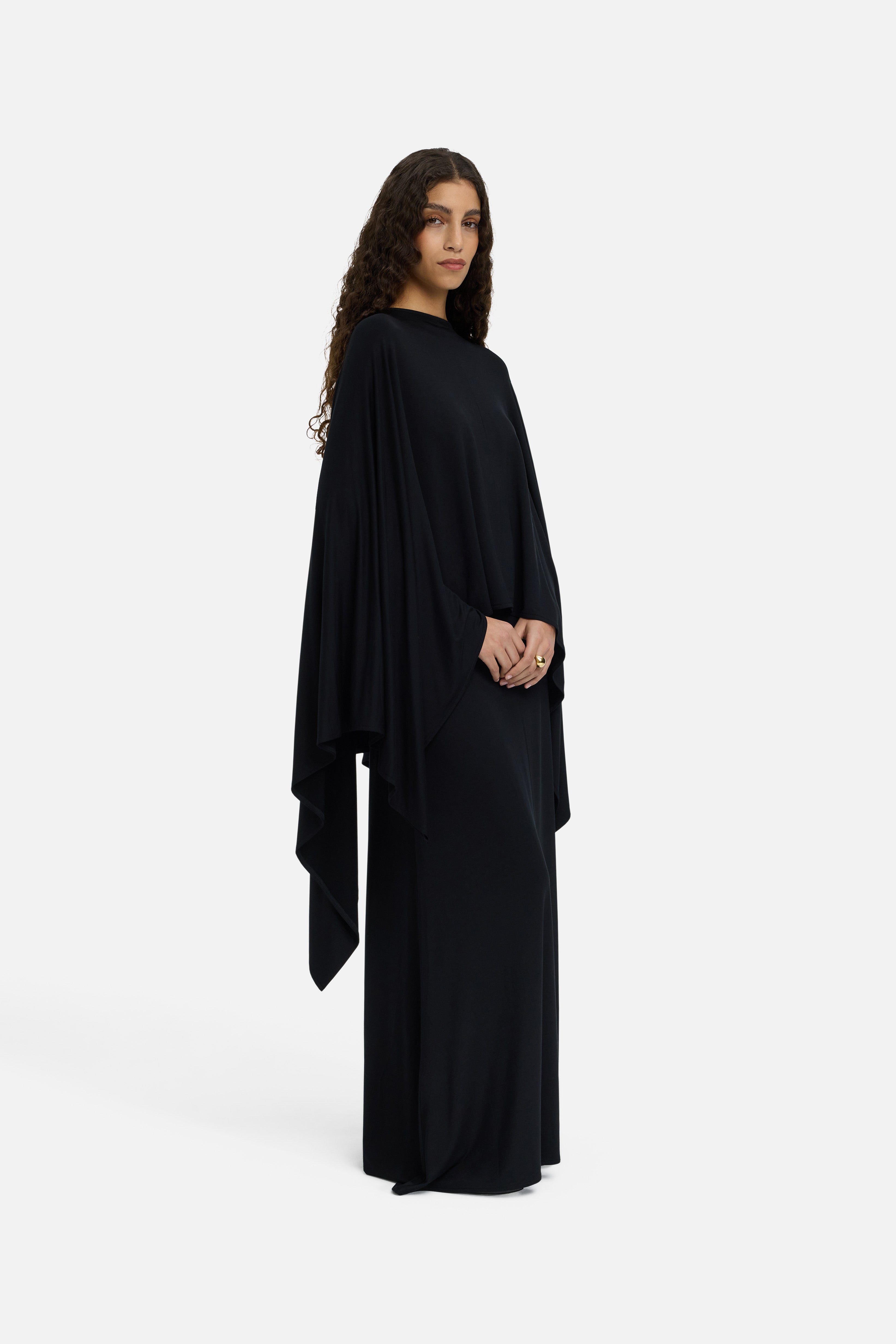 Side view model wearing black maxi skirt