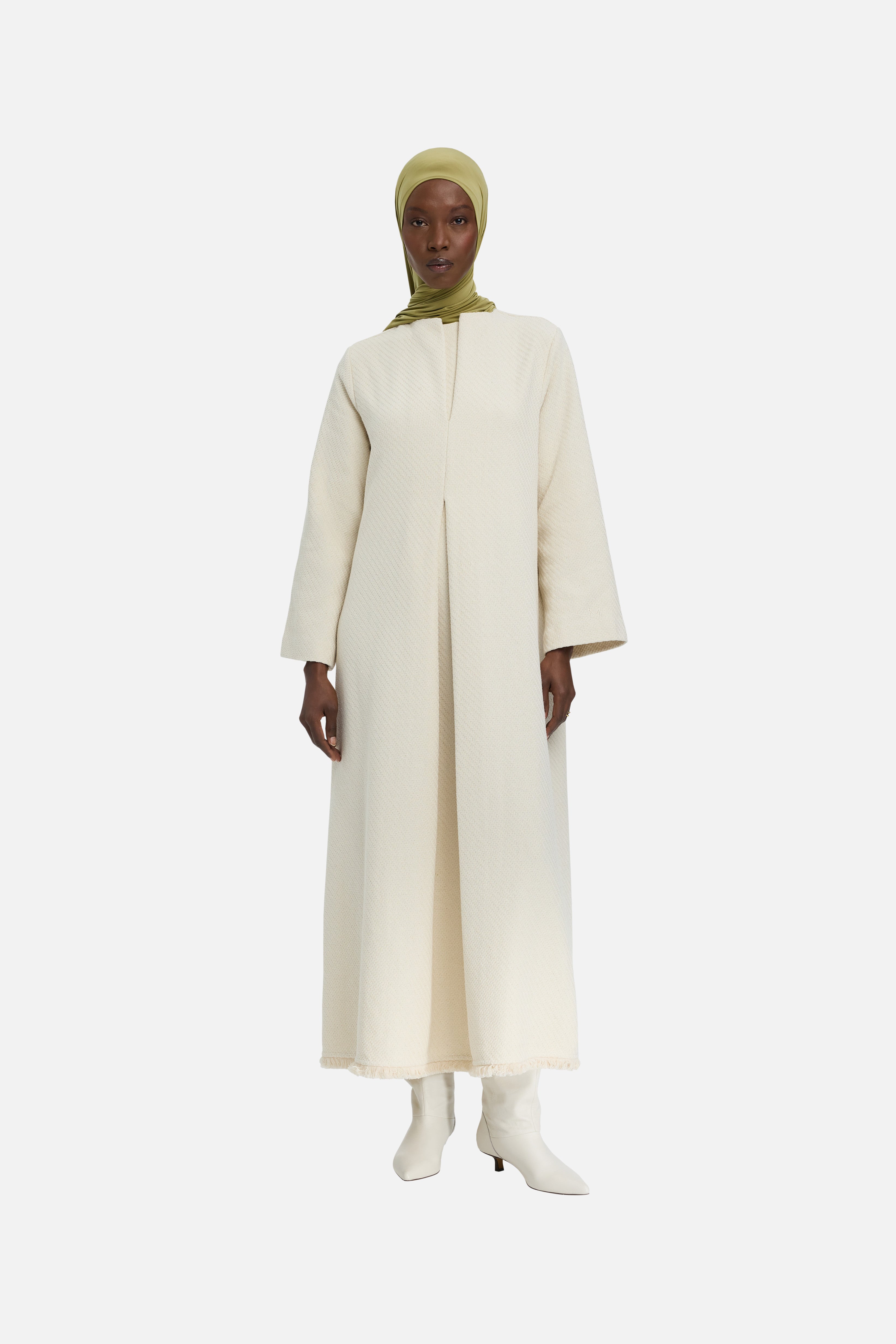 Front view model wearing off white dress and green headscarf
