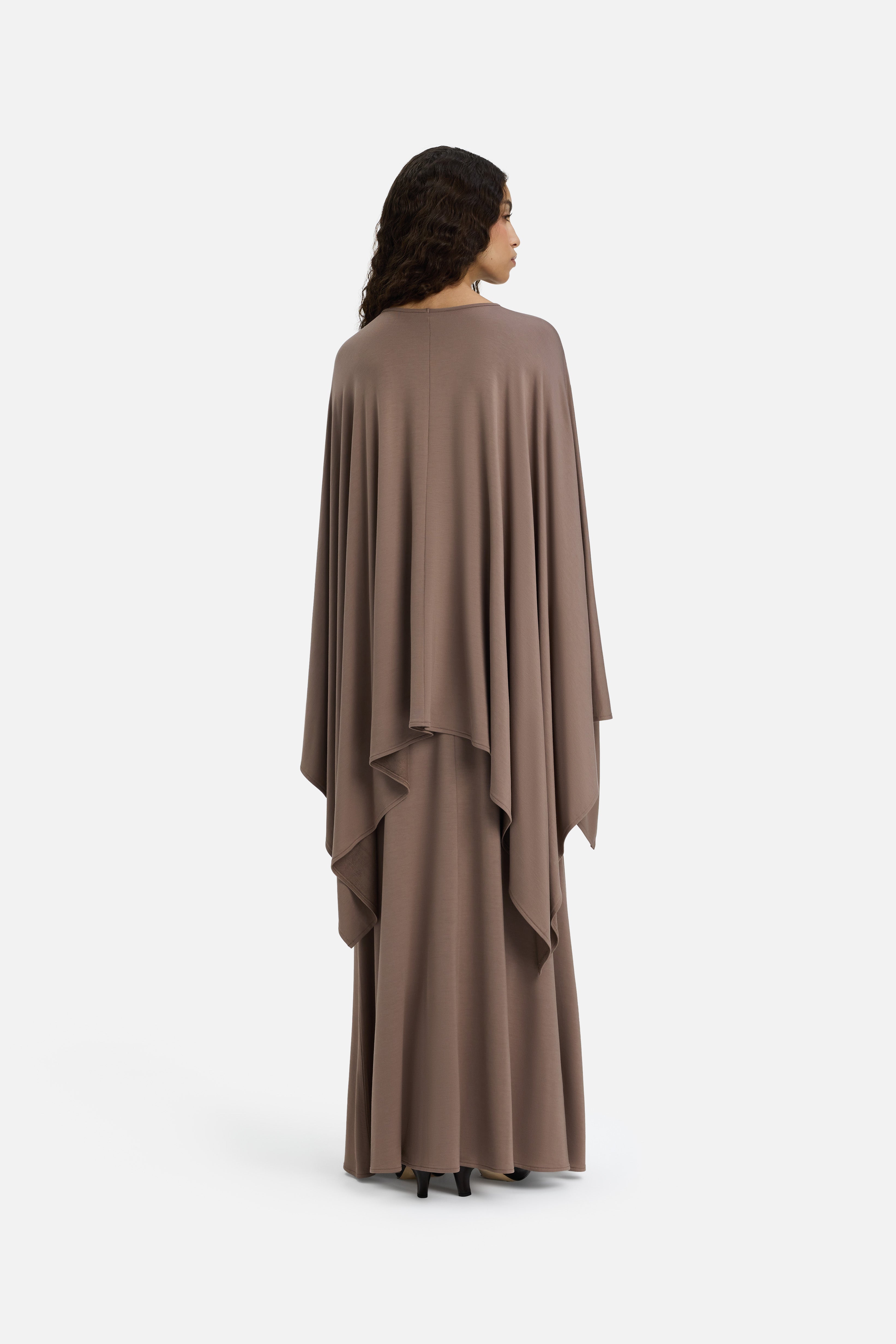 Model wearing taupe MERRACHI cape, back view
