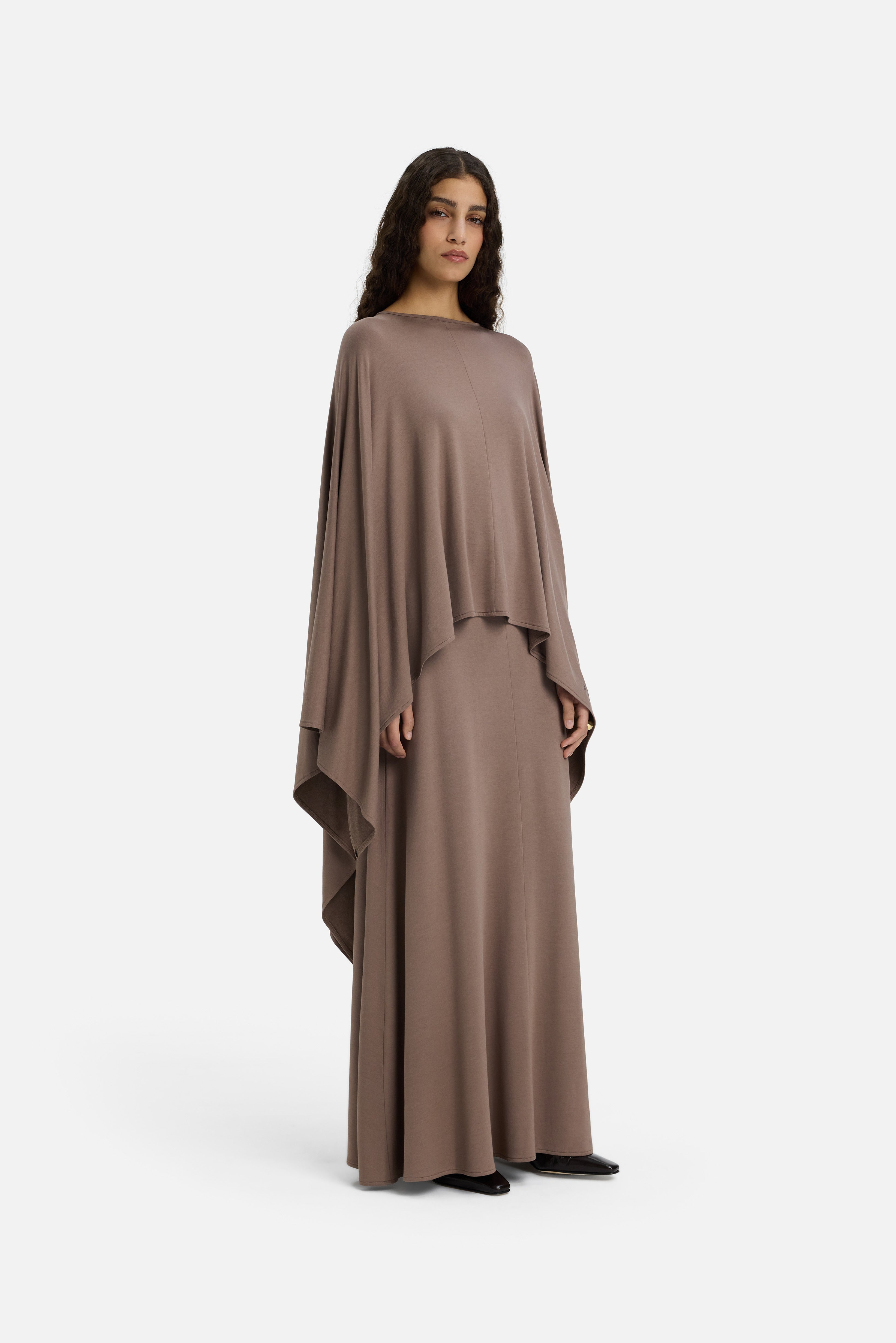 Side view model wearing taupe maxi skirt