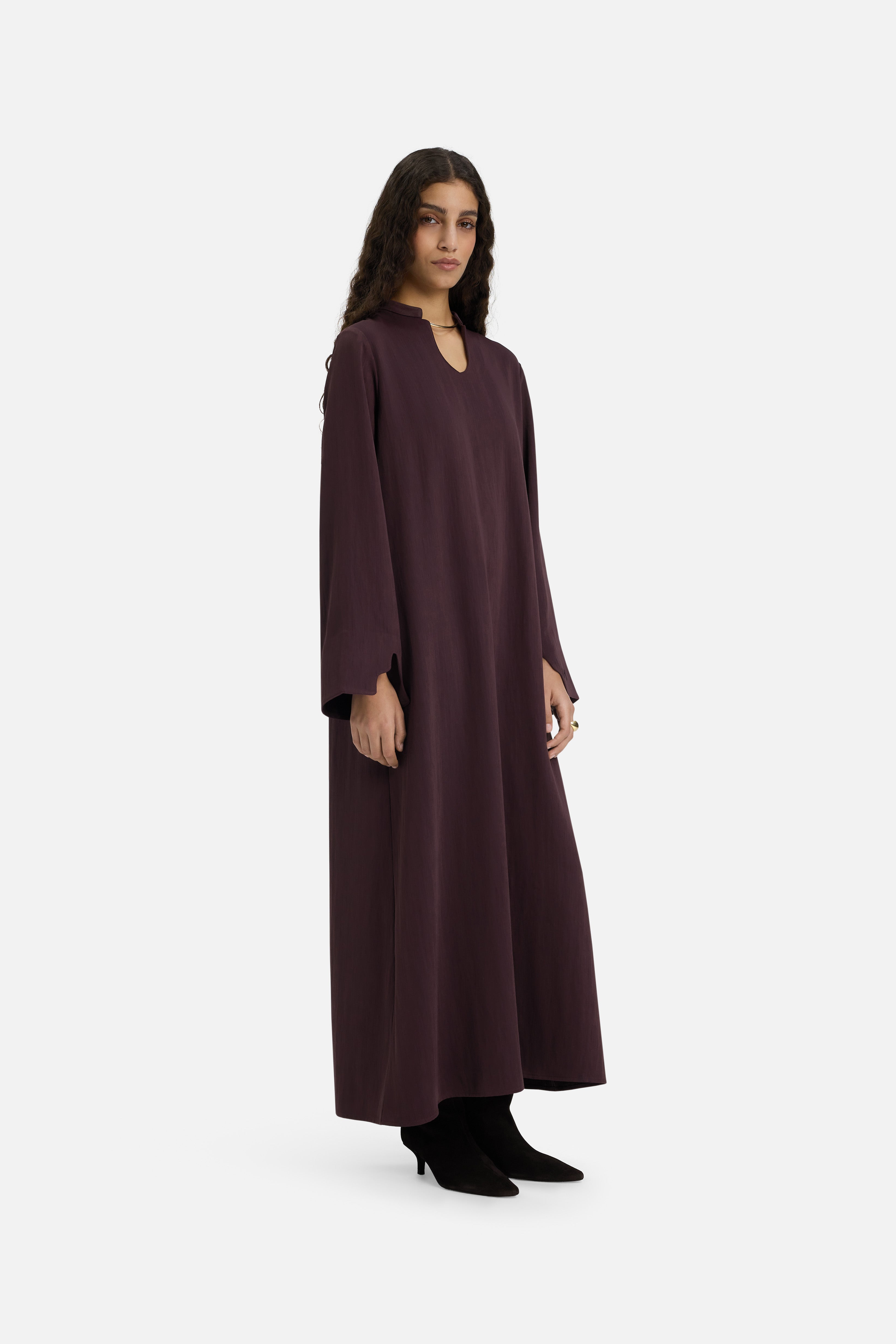 Side view model wearing purple dress