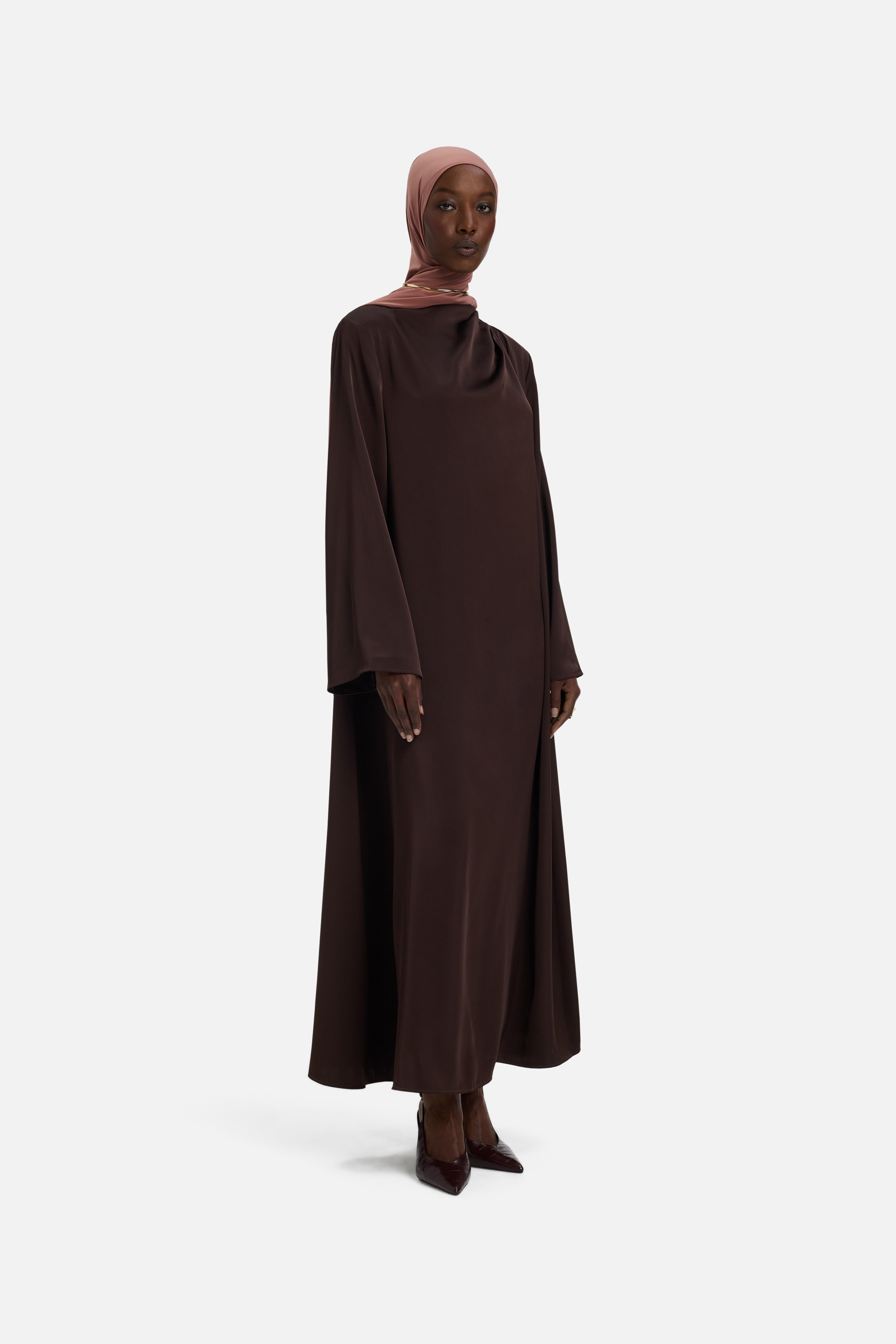 Side view model wearing dark brown dress