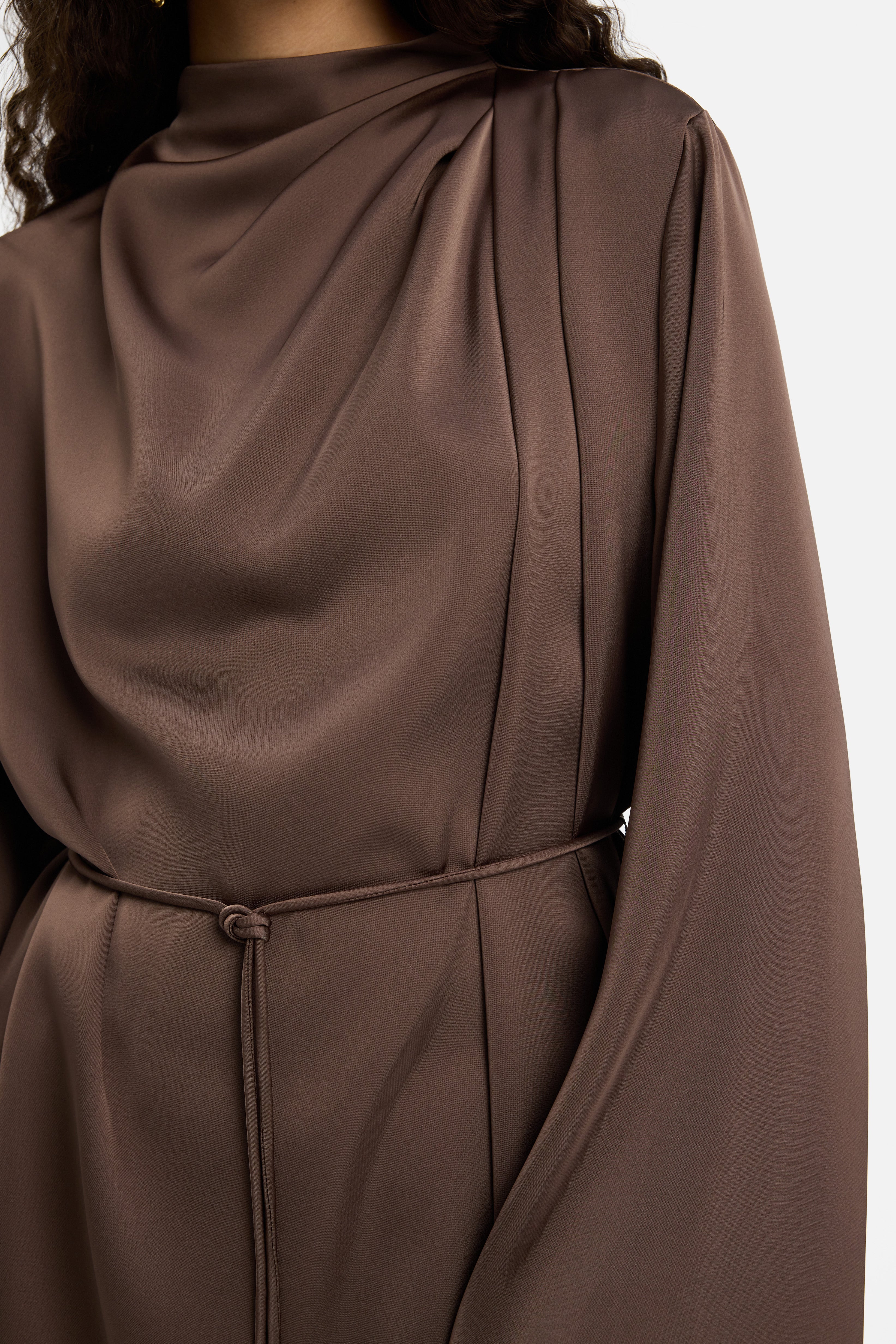 Detail shot model wearing brown blouse
