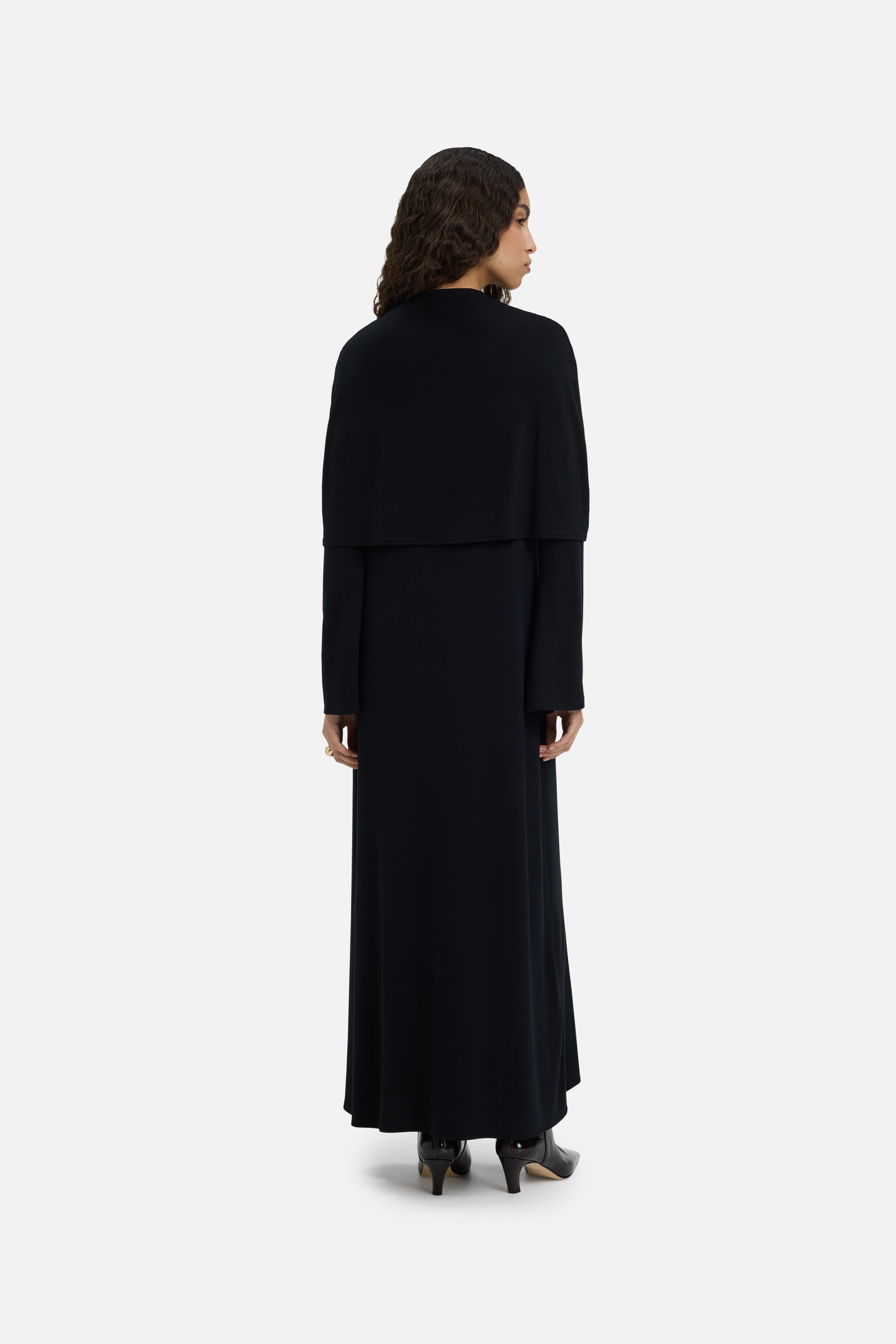 Back view model wearing black dress