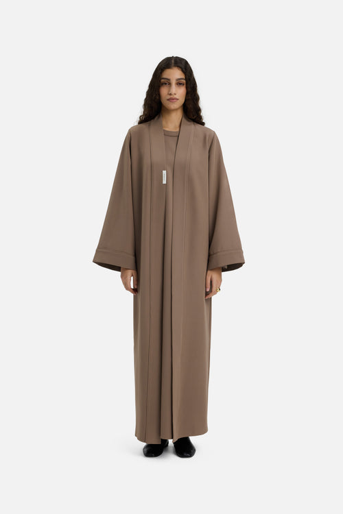 Front view model wearing taupe abaya
