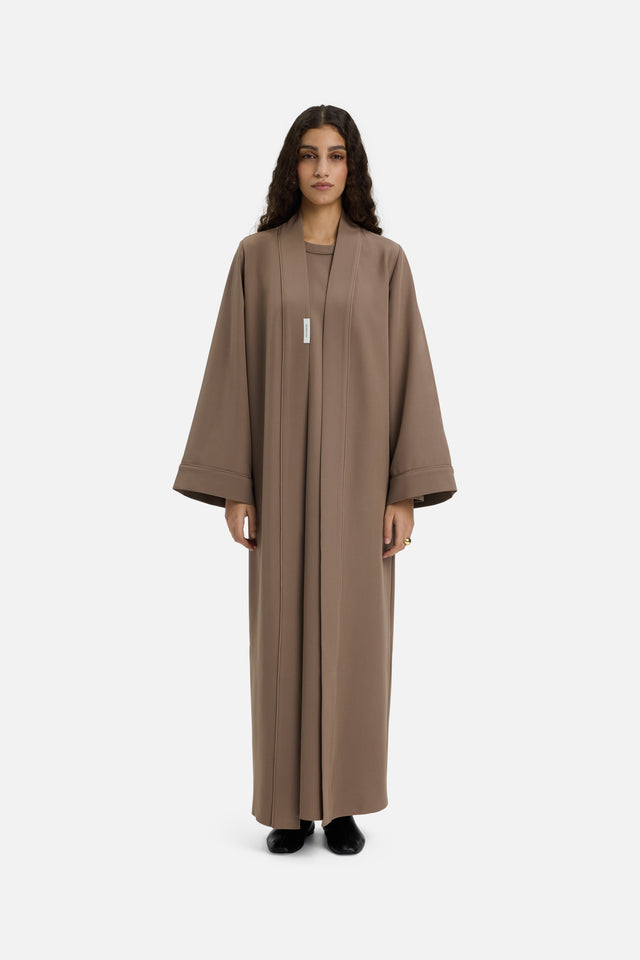 Front view model wearing taupe abaya