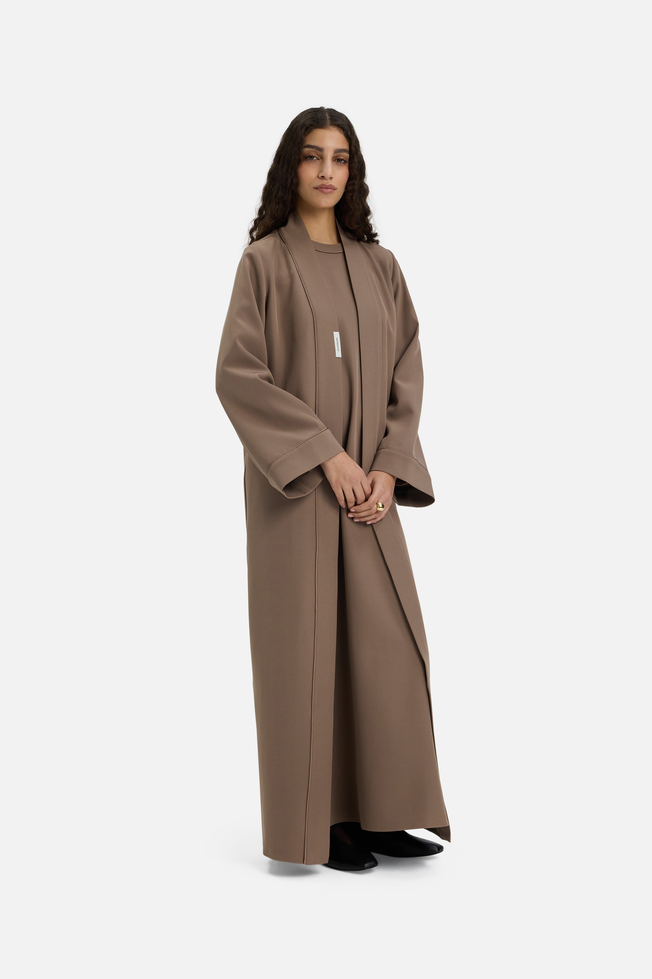 Front view model wearing taupe abaya