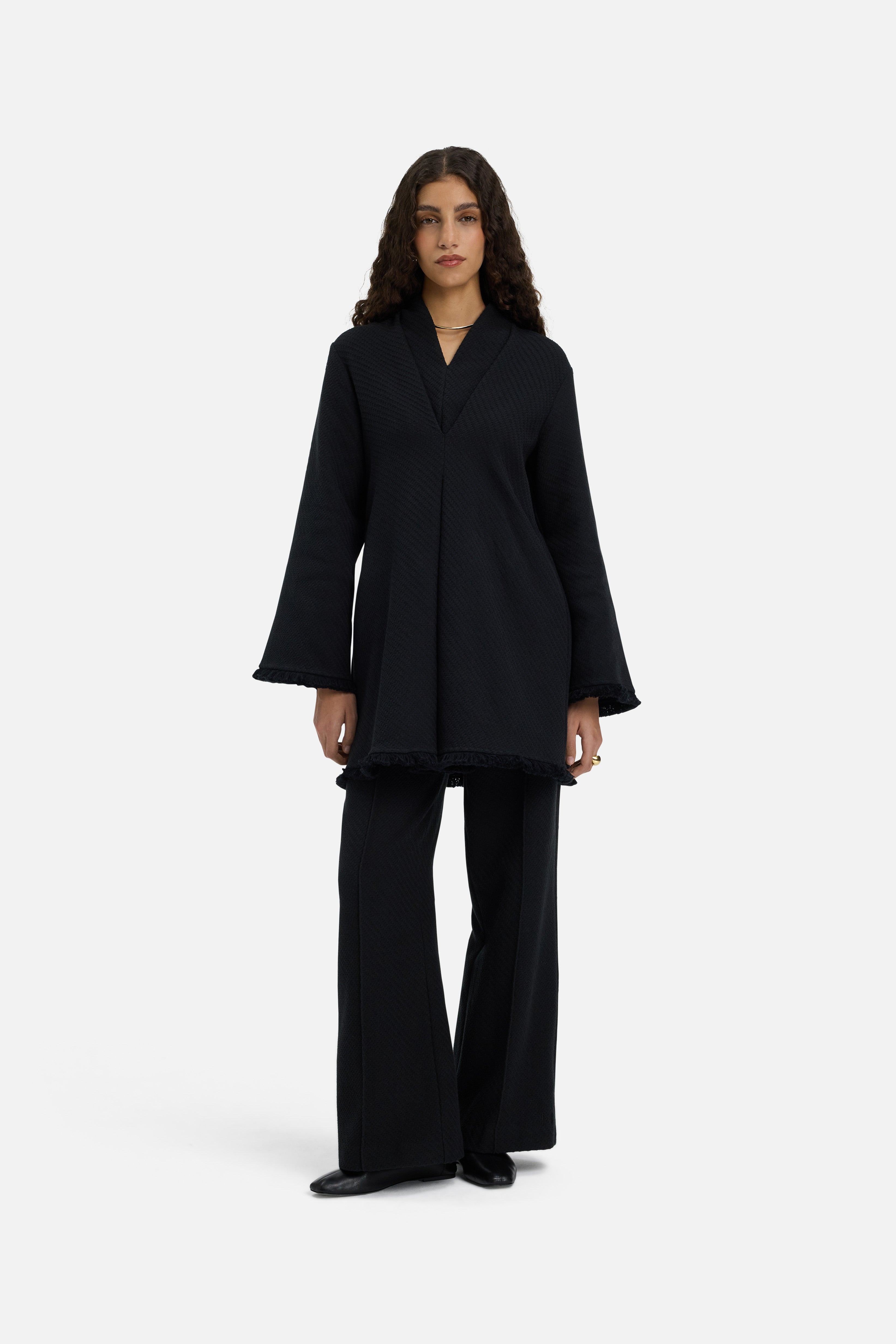 Front view model wearing black trousers