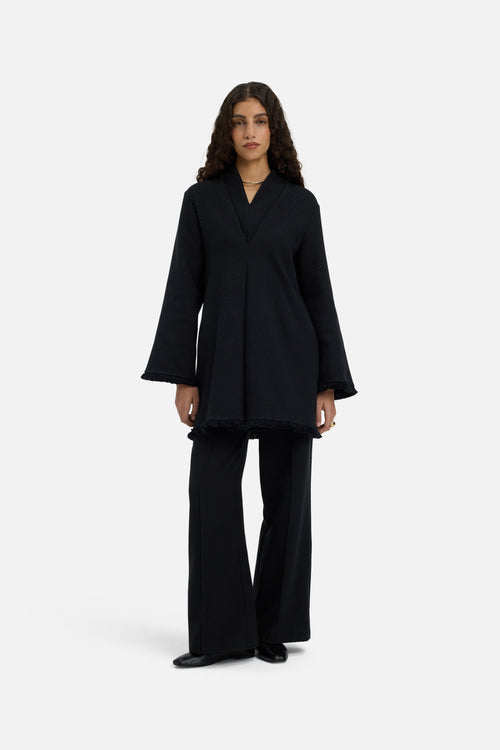 Front view model wearing black trousers