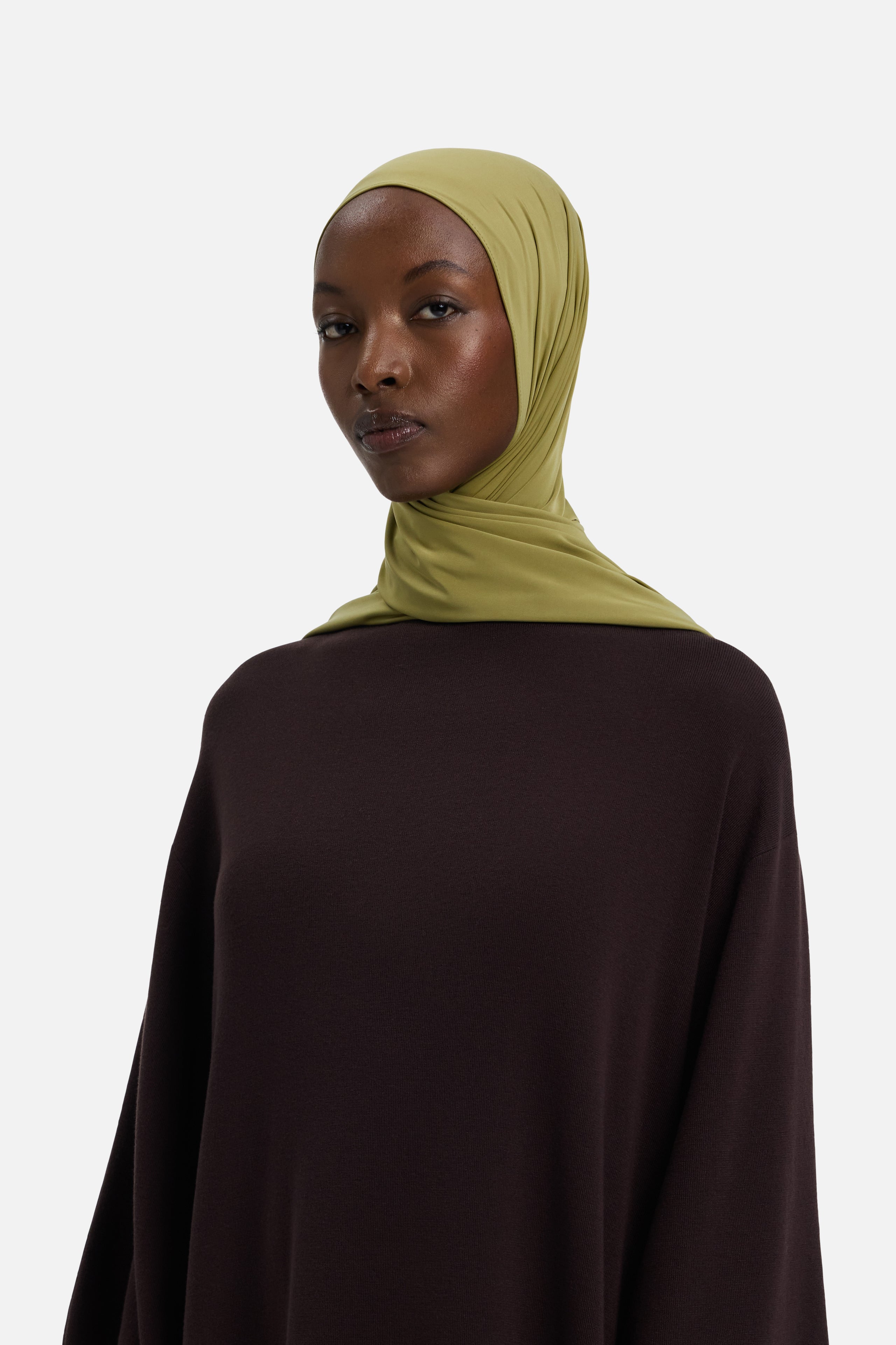 Model wearing green MERRACHI headscarf, front view