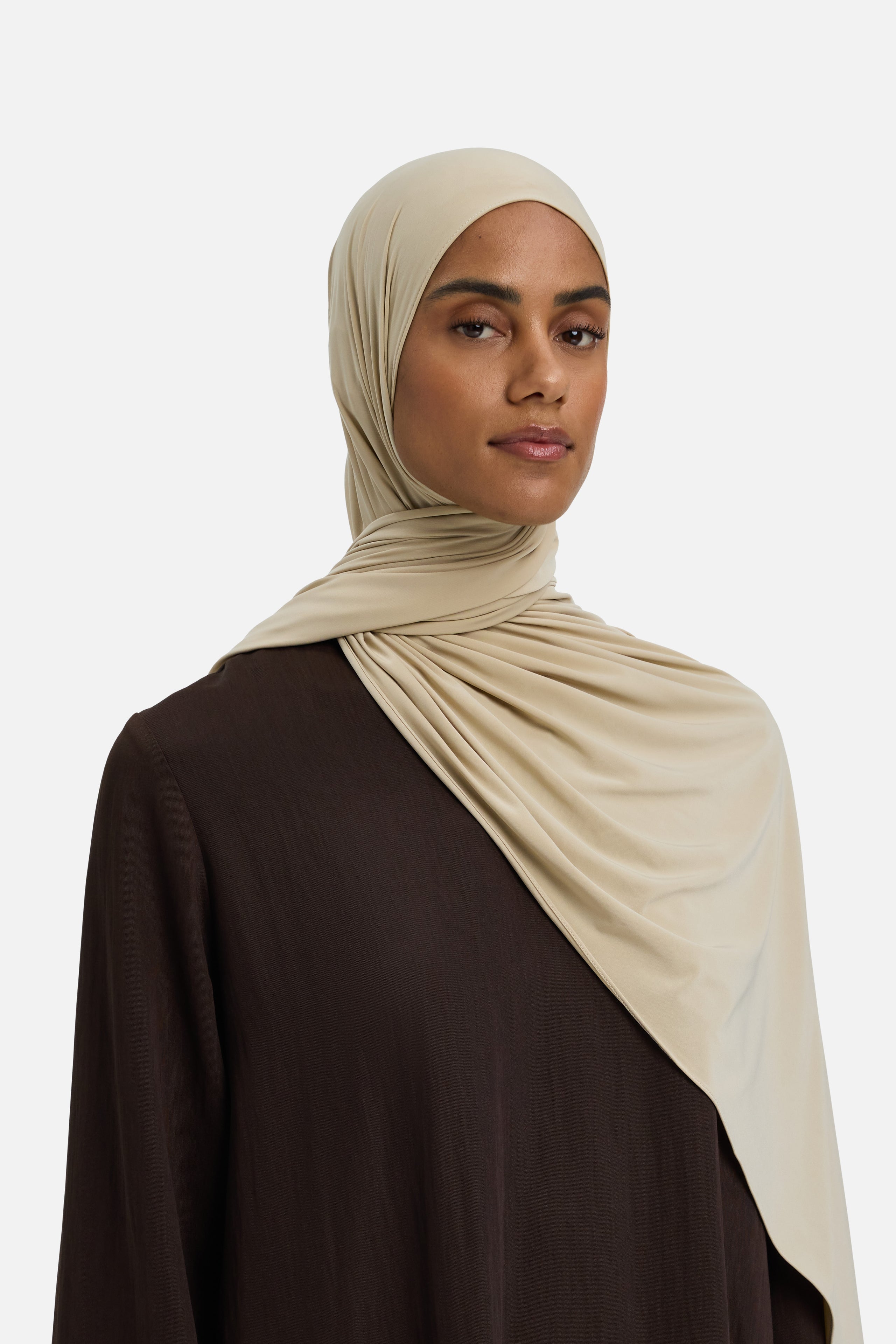 Model wearing beige MERRACHI headscarf, front view